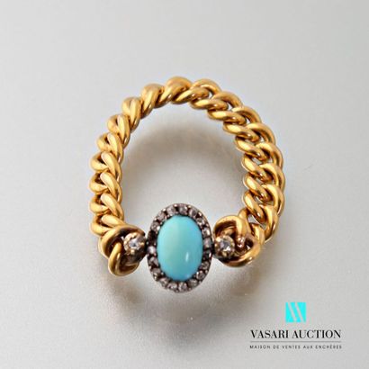 null Flexible ring in 750 thousandths yellow gold set with an oval turquoise surrounded...