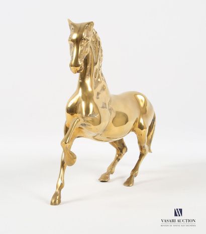 null Sujet en métal doré figurant une cheval l'antérieur levé 
(petites usures à...