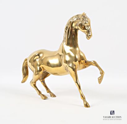 null Sujet en métal doré figurant une cheval l'antérieur levé 
(petites usures à...