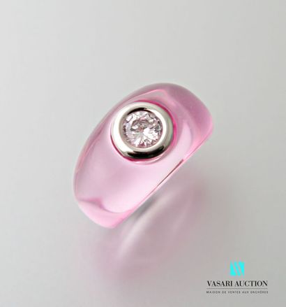 Pink plexiglass ring set with a synthetic...