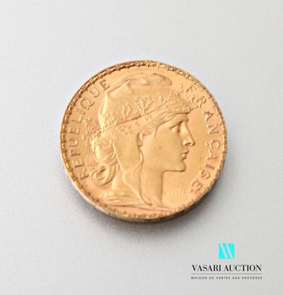 A 20 franc gold coin featuring Marianne engraved...
