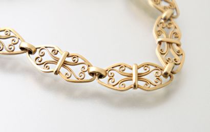 null Flexible bracelet in 750 thousandths gold with openwork and filigree links,...