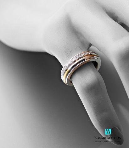 null Garel in Paris, a ring in yellow and white gold 750 thousandths, wide band embellished...