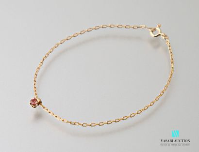 null Flexible bracelet in yellow gold 750 thousandths with a charm set with a pink...