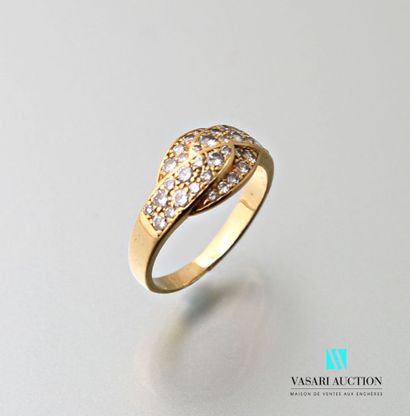 null Ring in yellow gold 750 thousandths with a cross pattern paved with thirty-six...