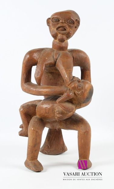 null Woman nursing her child seated on a carved wooden stool
20th century
Height...