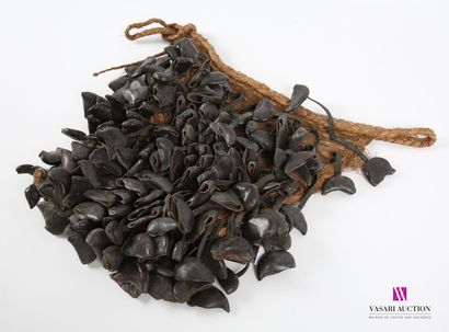 null Bendo shaker" dance ensemble made of entangled walnut shells suspended by rubber...