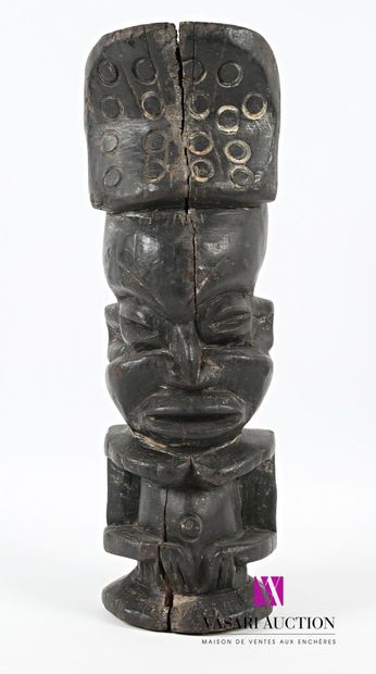 null Carved wooden totem statue with dark patina depicting an anthropomorphic figure,...