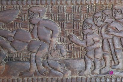 null Natural wood panel decorated with a wrestling scene featuring multiple combatants...