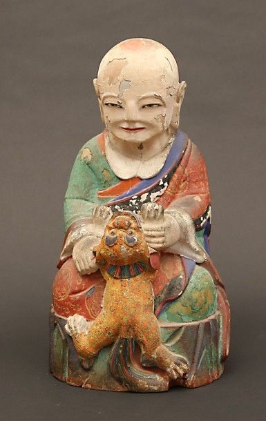 null Chine

Bouddha tenant un chien

Sculpture en bois polychrome

XIXème siècle

Haut...