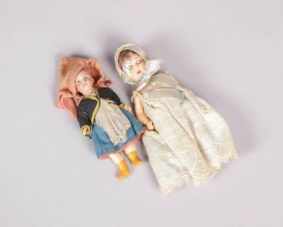 null Deux poupées, têtes en porcelaine

(manques de peintures, défauts de cuisson,...