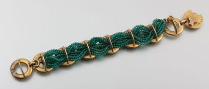 null BURMA

Bracelet en métal doré et tresses de perles vertes.

(usures d'usage...