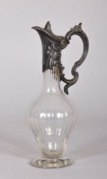 null Aiguière en verre col en métal argenté,

XXème siècle

Haut. : 34 cm 

Carafe...