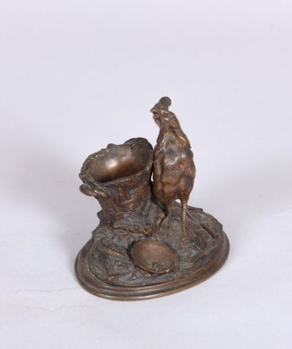 null Sujet en bronze à patine brune figurant un coq près d'un panier.

XIXème siècle

Haut....