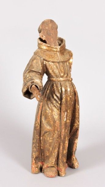 null Sujet en bois sculpté à rehauts dorés figurant un moine 

XVIIIème siècle

(accidents,...