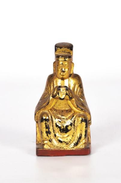 null Bouddha en bois laqué rouge et or 

Fin XIXème siècle

(sauts de laque)

Haut....