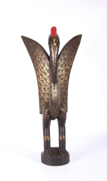 null NORD OUEST AFRIQUE

Statue en bois naturel et métal figurant un oiseau aux ailes...