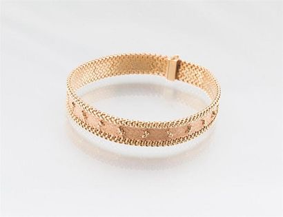 null Bracelet souple en or 750/00, le fond amati souligné de deux rangs d'or poli...