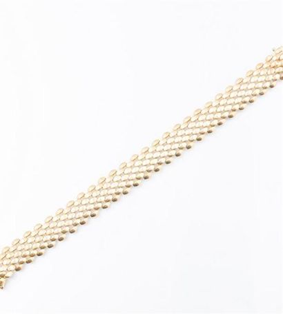 null Bracelet souple en or jaune 750/°° à maille grain de riz, fermoir à clipet avec...