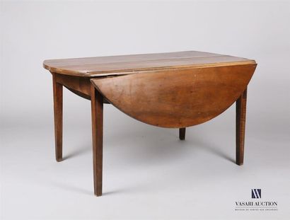 null Table à volet de forme ronde en bois naturel, elle repose sur quatre pieds gaines...