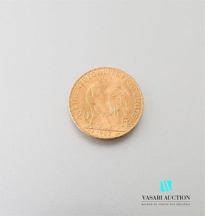 null Une pièce en or de 20 Frcs République Française 1907
Poids : 6,45 g