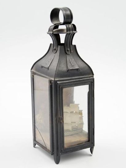 Lantern in sheet metal forming a diorama...