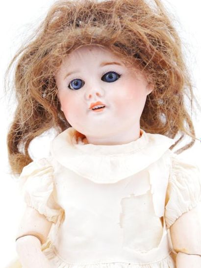null S.F.B.J, Paris 60
Doll with porcelain head. Mobile eyes and open 
mouth Body...