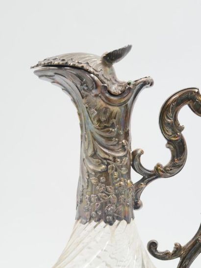 null Baluster-shaped ewer in glass with torsos ribs, the silver frame (950 thousandths)...