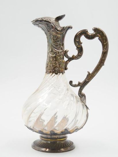 null Baluster-shaped ewer in glass with torsos ribs, the silver frame (950 thousandths)...