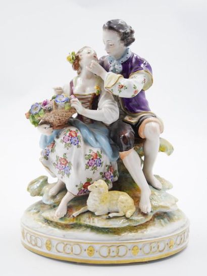 null Porcelain group with polychrome glaze on the subject of a gallant scene, in...
