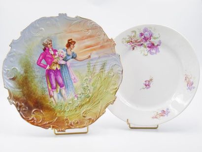 null P.P. Limoges 
Porcelain dish with a scalloped rim with polychrome decoration...