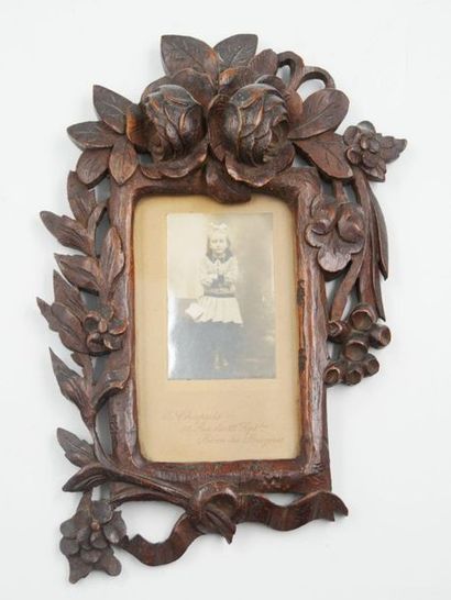 null Three carved natural wood frames with an openwork floral decoration and a small...