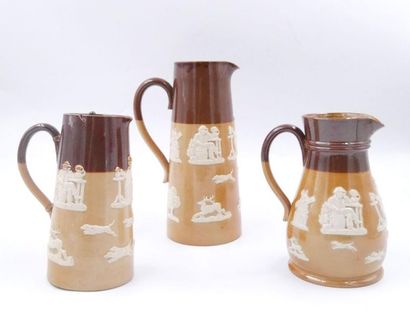 null ROYAL DOULTON: Set 
of three enamelled earthenware jugs,

marked in hollow,...