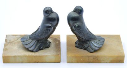 Pair of bronze bookends with bird decoration...