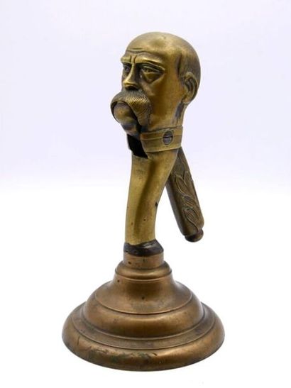Bronze nutcracker with a man's face 
H. :...