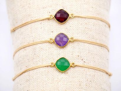 null NILAI, Paris 

Set of three fancy bracelets with coloured stones 

Cord with...