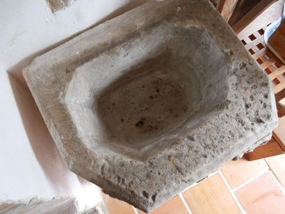 null Baptismal font basin in carved stone with acanthus leaf decoration in high relief.

Ancient...