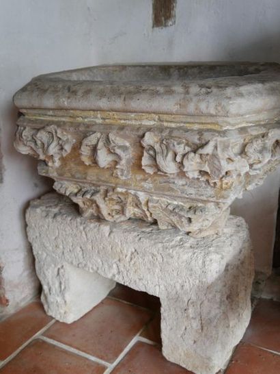 null Baptismal font basin in carved stone with acanthus leaf decoration in high relief.

Ancient...