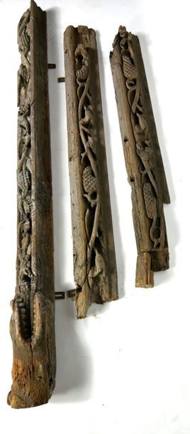 null Pair of carved wooden fireplace elements with vine branches and snake heads...
