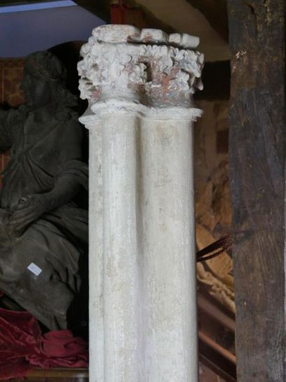 null Carved limestone lot including three capitals and a pair of columns composed...