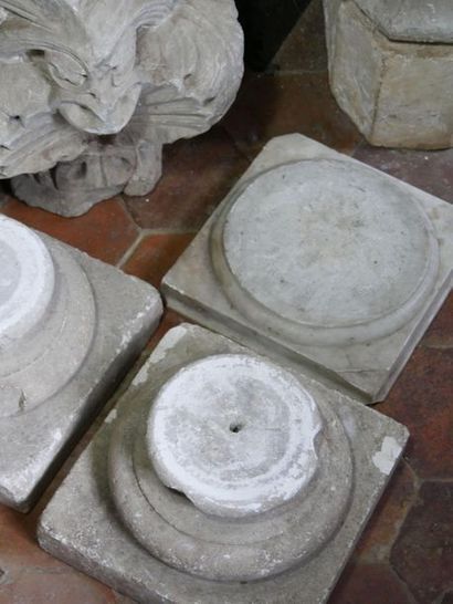 null Carved limestone lot including three capitals and a pair of columns composed...