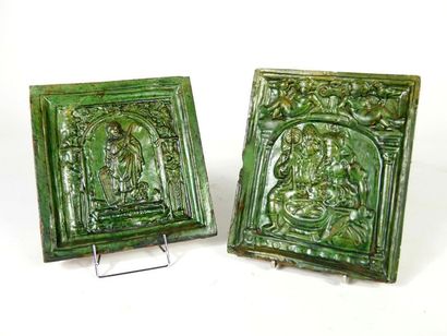 null GERMANY: 

Two glazed earthenware stove tiles with green slip, decorated with...