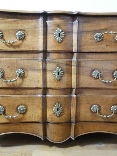 null Moulded walnut crossbow chest of drawers, opening by three drawers on three...