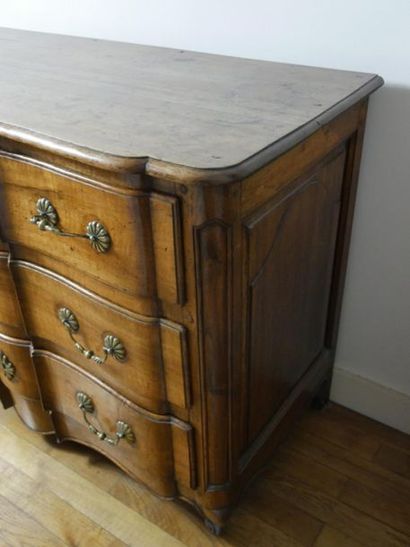 null Moulded walnut crossbow chest of drawers, opening by three drawers on three...