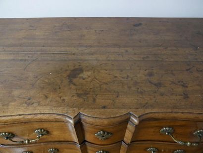 null Moulded walnut crossbow chest of drawers, opening by three drawers on three...