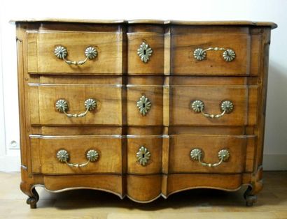 null Moulded walnut crossbow chest of drawers, opening by three drawers on three...