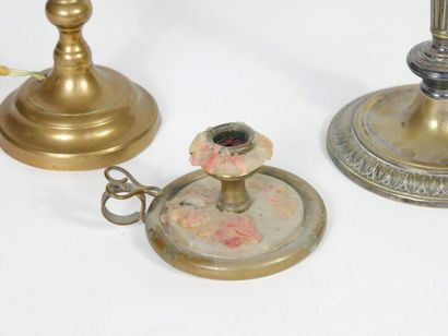 null Lot including two bronze torches and a hand candle holder.

19th century period.

H...