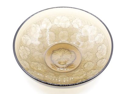 null Pressed smoked glass moulded bowl with floral decoration 
Diam: 28 cm 