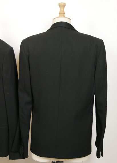 null 
DIOR




Set of two tuxedo-style jackets in black wool, one with a notched...