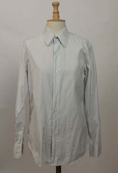  YVES SAINT LAURENT 
Set of four straight cotton shirts, small collar with single...